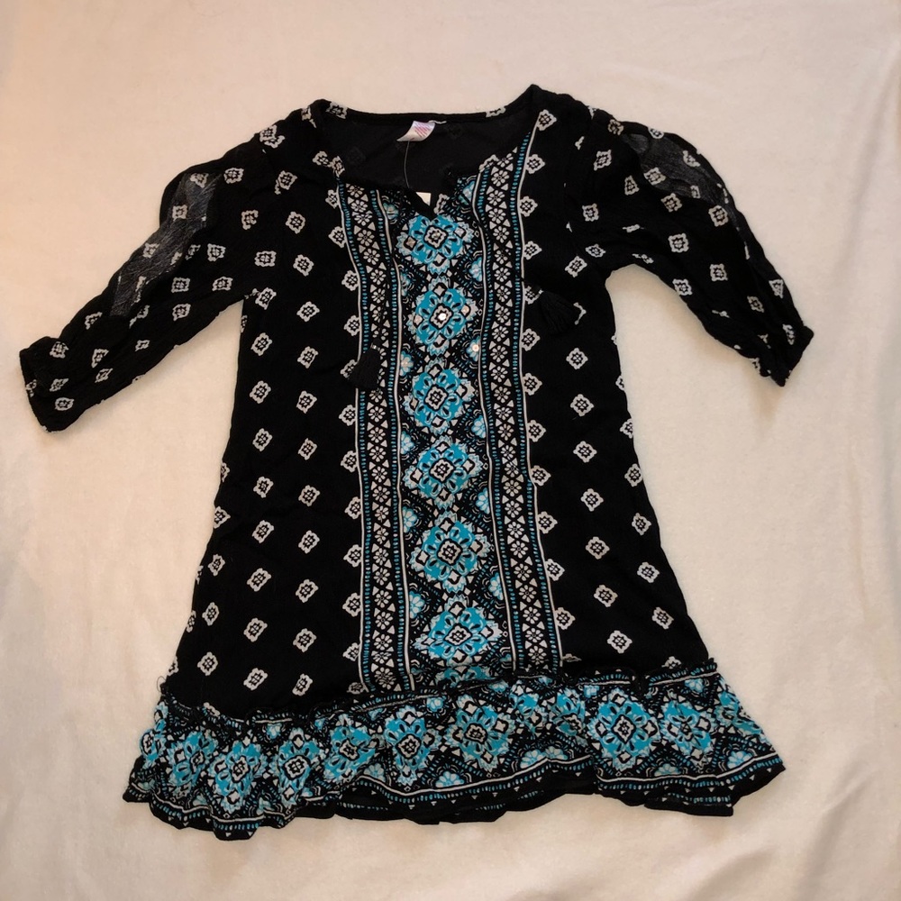 black and blue patterned beach coverup
